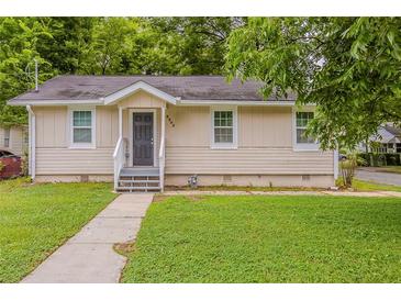 Charming single-story home with a well-maintained front lawn and inviting entrance at 2245 Dauphine St, Atlanta, GA 30344