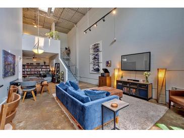 Spacious living room with high ceilings and modern decor, great for entertaining and relaxing at 195 Arizona Ne Ave # 199, Atlanta, GA 30307