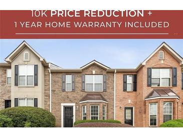 Charming townhome with varied brick facade and manicured landscaping offers a $10K price reduction at 4413 Pinscher St, Union City, GA 30291