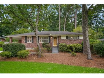 Charming brick home featuring a welcoming entrance and mature landscaping, creating inviting curb appeal at 2790 Laurel Ridge Dr, Decatur, GA 30033