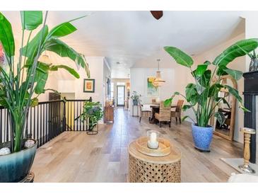 Bright living room features hardwood floors, unique decor, and plenty of natural light from many windows at 6426 Queens Court Trce # 7, Mableton, GA 30126