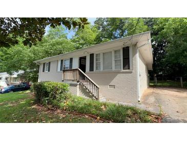Charming single-story home with a brick exterior and a well-maintained front yard at 1829 Goddard Se St, Atlanta, GA 30315