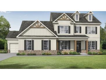 Charming two-story home with board and batten siding, a well-manicured lawn, and inviting front porch at 1285 Pj East Rd, Covington, GA 30014