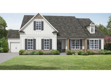 Charming single Gathering home with a covered porch, a brick foundation, and a well-manicured lawn at 1297 Pj East Rd, Covington, GA 30014