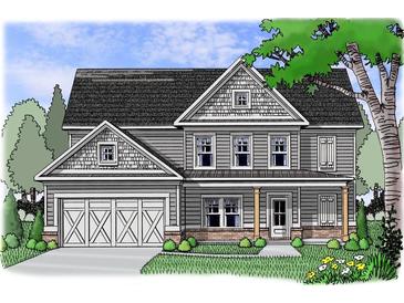 Charming two-story home featuring a covered front porch, gray siding, attached garage and manicured landscaping at 1045 Birch Way, Loganville, GA 30052