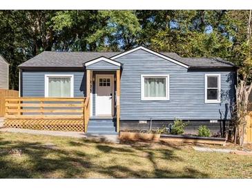 Charming blue home with a cozy front porch and well-maintained landscaping at 205 Maple St, Atlanta, GA 30354