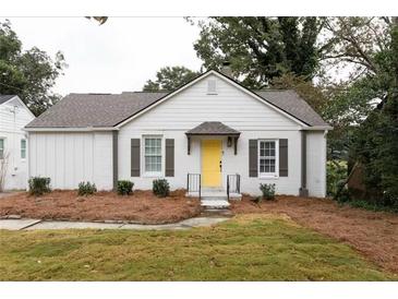 Charming home with a bright yellow front door and well-maintained landscaping at 3198 Oakdale Rd, Atlanta, GA 30354