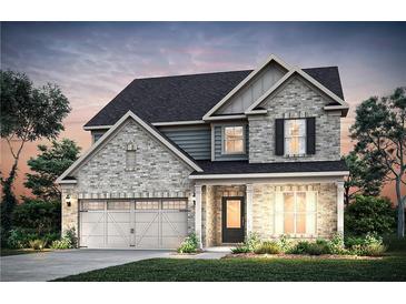 Charming two-story home with a brick facade, attached garage, landscaped yard, and welcoming front porch at 4885 Rosarian Drive, Cumming, GA 30040