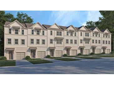 Modern townhome exterior with a neutral color scheme and attached garages at 1336 Lakota Pl, Atlanta, GA 30315