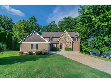 Charming two-story home with landscaped front yard and inviting stone accents at 4252 Keheley Lake Dr, Marietta, GA 30066