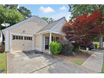 Charming single-Gathering home featuring an attached two-car garage and well-manicured landscaping at 5069 Kathryn Glen Dr, Acworth, GA 30101