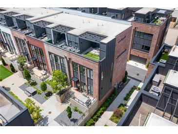 Stunning aerial view of brick townhomes featuring private rooftop terraces and meticulous landscaping at 1244 Chelsea Nw Cir, Atlanta, GA 30318