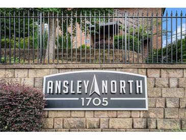 A sign for Ansley North 1705 with a stone brick wall and black iron fence at 1705 Monroe Ne Dr # E3, Atlanta, GA 30324