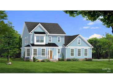Charming two-story home with a welcoming front porch and professionally landscaped yard at 4057 Andover Cir, Mcdonough, GA 30252