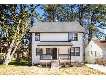 Charming two-story home with a covered front porch and well-maintained landscaping at 870 Gaston Sw St, Atlanta, GA 30310