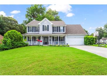 Charming two-story home with a welcoming front porch and well-manicured lawn at 10 Callaway Ct, Hiram, GA 30141