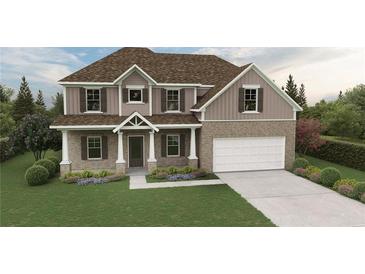 Charming two-story home featuring a brick facade, covered entry, and an attached two-car garage at 3623 Squires Park Ln, Loganville, GA 30052