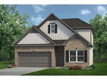 Charming two-story home boasts a brick facade, grey garage door, and a manicured lawn, perfect for suburban living at 847 Kensington St, Kingston, GA 30145