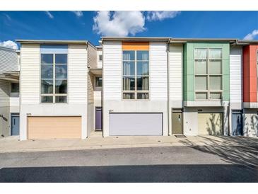 Charming townhomes with large windows and colorful accents in a well-maintained community at 1271 Mackintosh Nw Park # 30, Atlanta, GA 30318