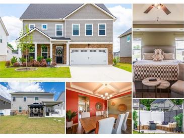 Beautiful two-story home with attached two-car garage, manicured lawn, and inviting curb appeal at 13568 Scenic Pkwy, Covington, GA 30014