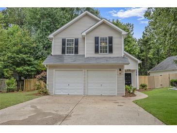 Charming two-story home featuring a two-car garage and well-maintained landscaping in a desirable location at 161 Stoneforest Dr, Woodstock, GA 30189