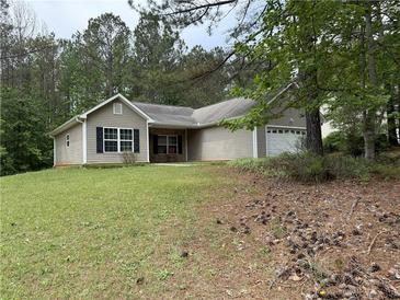Charming single-story home with neutral siding, black shutters, and a well-maintained front lawn at 169 Rachel Blvd, Temple, GA 30179
