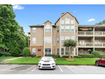 Exterior of the building with well-kept lawn and parking spaces at 719 Mcgill Park Ne Ave, Atlanta, GA 30312