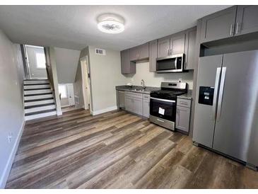 Modern kitchen featuring stainless steel appliances and updated cabinetry at 405 Fairburn Sw Rd # 231, Atlanta, GA 30331