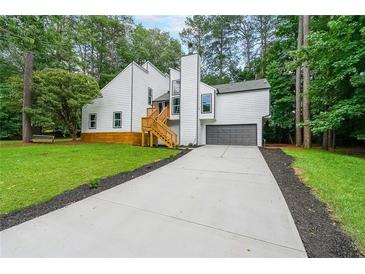 Beautifully renovated two story home with new paint, attached garage and large driveway at 2189 Spear Point Dr, Marietta, GA 30062