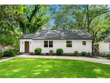 Charming home with a well-manicured lawn and a welcoming exterior at 1556 Braeburn Se Dr, Atlanta, GA 30316