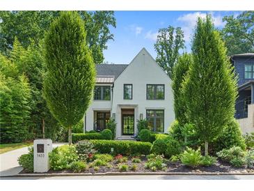 Beautiful two-story home with a well-manicured front yard and charming curb appeal at 1433 Wessyngton Ne Rd, Atlanta, GA 30306
