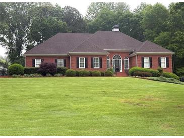 Charming brick home with manicured lawn and black shutters at 753 Summer Ridge Dr, Villa Rica, GA 30180