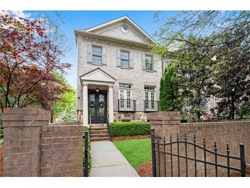 Charming two-story brick home with a landscaped front yard and an inviting entrance at 3663 Brookhaven Manor Crossing Ne # 1, Atlanta, GA 30319