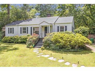 Charming single story home with landscaped front yard and stone walkway at 1908 E Roxboro Ne Rd, Atlanta, GA 30324