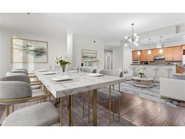 Bright dining area featuring a modern table, seating for eight, and an open-concept kitchen at 270 17Th Nw St # 4306, Atlanta, GA 30363