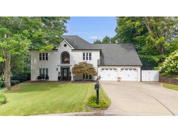 Charming two-story home with a manicured lawn and attached two-car garage at 5286 Wild Indigo Nw Way, Acworth, GA 30102