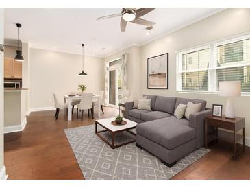 Inviting living room with hardwood floors, modern furnishings, and abundant natural light at 2230 Cheshire Bridge Ne Rd # 401, Atlanta, GA 30324