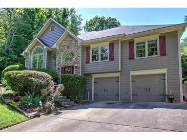 Charming two-story home featuring a two-car garage, stone accents, and well-manicured landscaping at 263 Bennett Farms Trl, Acworth, GA 30102