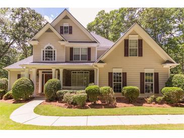 Charming two-story home with manicured landscaping and a welcoming front porch at 5581 Fox Glove Ct, Douglasville, GA 30135