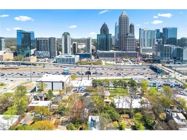Stunning aerial view of the city skyline from a home located near major highways and urban amenities at 1231 Barnes Nw St, Atlanta, GA 30318