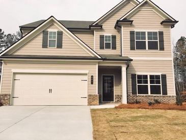 Charming two-story home featuring a two-car garage and a well-maintained front lawn at 126 Jacobs Ln, Loganville, GA 30052