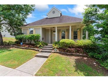 Charming home with a welcoming front porch and well-maintained landscaping, perfect for a cozy lifestyle at 615 Brookwater Dr, Stockbridge, GA 30281