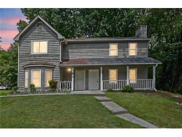 Charming two-story home featuring a welcoming front porch and well-maintained landscaping at 4520 Coopers Creek Se Cir, Smyrna, GA 30082
