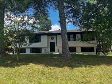 Charming home featuring a well-maintained front yard and classic architectural details at 2475 Cajun Dr, Marietta, GA 30066
