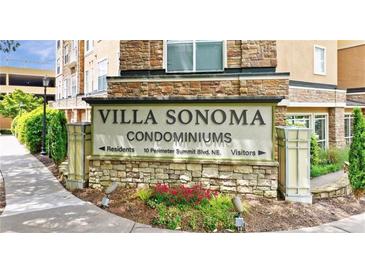 Stone Villa Sonoma Condominiums sign with landscaping and a view of the building at 10 Ne Perimeter Summit Blvd # 3107, Atlanta, GA 30319