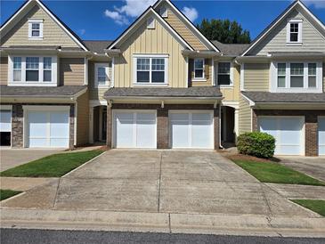 Charming townhomes featuring garages and landscaped front yards at 1865 Ellison Lakes Nw Ct # 21, Kennesaw, GA 30152