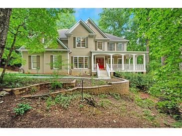 Inviting home with a charming porch and landscaped front yard at 1170 Spring Oak Way, Cumming, GA 30041