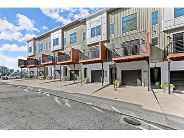 Modern townhome exterior showing private balconies and garages, adding curb appeal at 2327 Mason Dr # D23, Atlanta, GA 30316