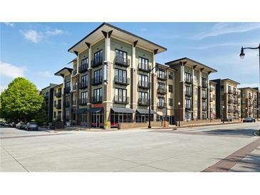 Modern condo building featuring balconies, street-level retail, and a contemporary design at 5300 Peachtree Rd # 2309, Chamblee, GA 30341
