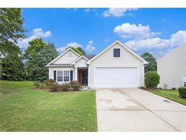 Charming single-Gathering home featuring a two-car garage, manicured lawn, and blossoming landscape at 7057 Silver Bend Ovrlk, Austell, GA 30168